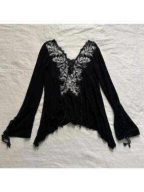 D.i.a. Black gothic blouse with lace details and bell sleeve